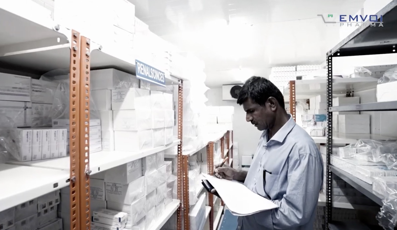 Team member checking pharmaceutical inventory